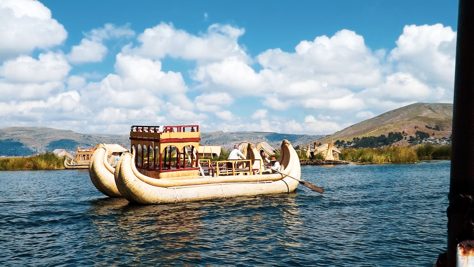 Puno & la Mística del Altiplano brown and white boat on water during daytime