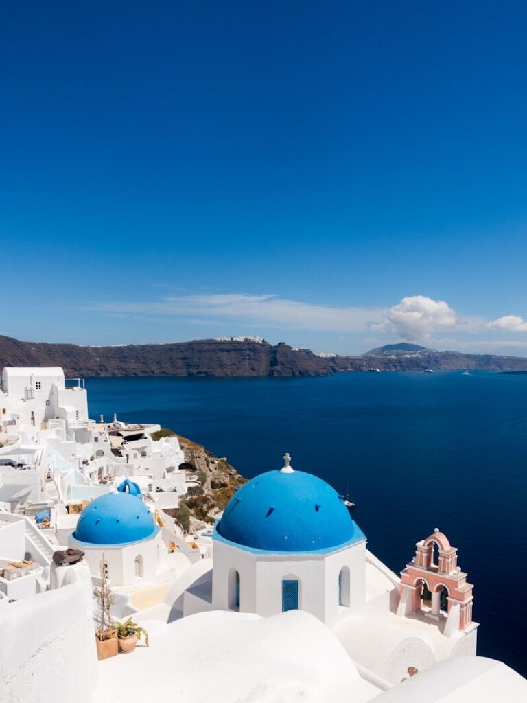 white and blue dome building near body of water during daytime