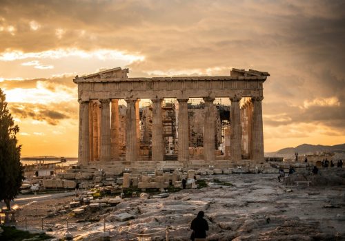 people walking near brown concrete building during daytime